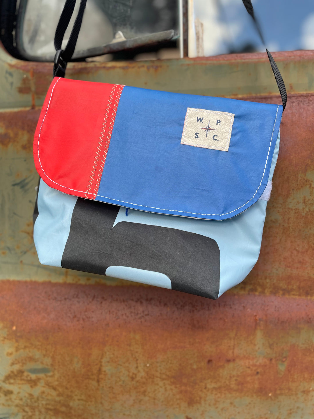 Atlas cross body bag in Blue and Red