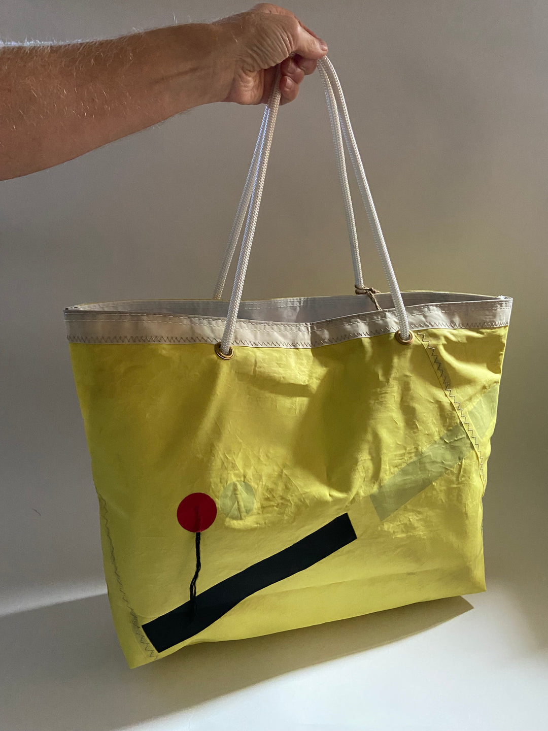 Trade Winds Tote in Yellow with black abstract stripes and tell tail wind string